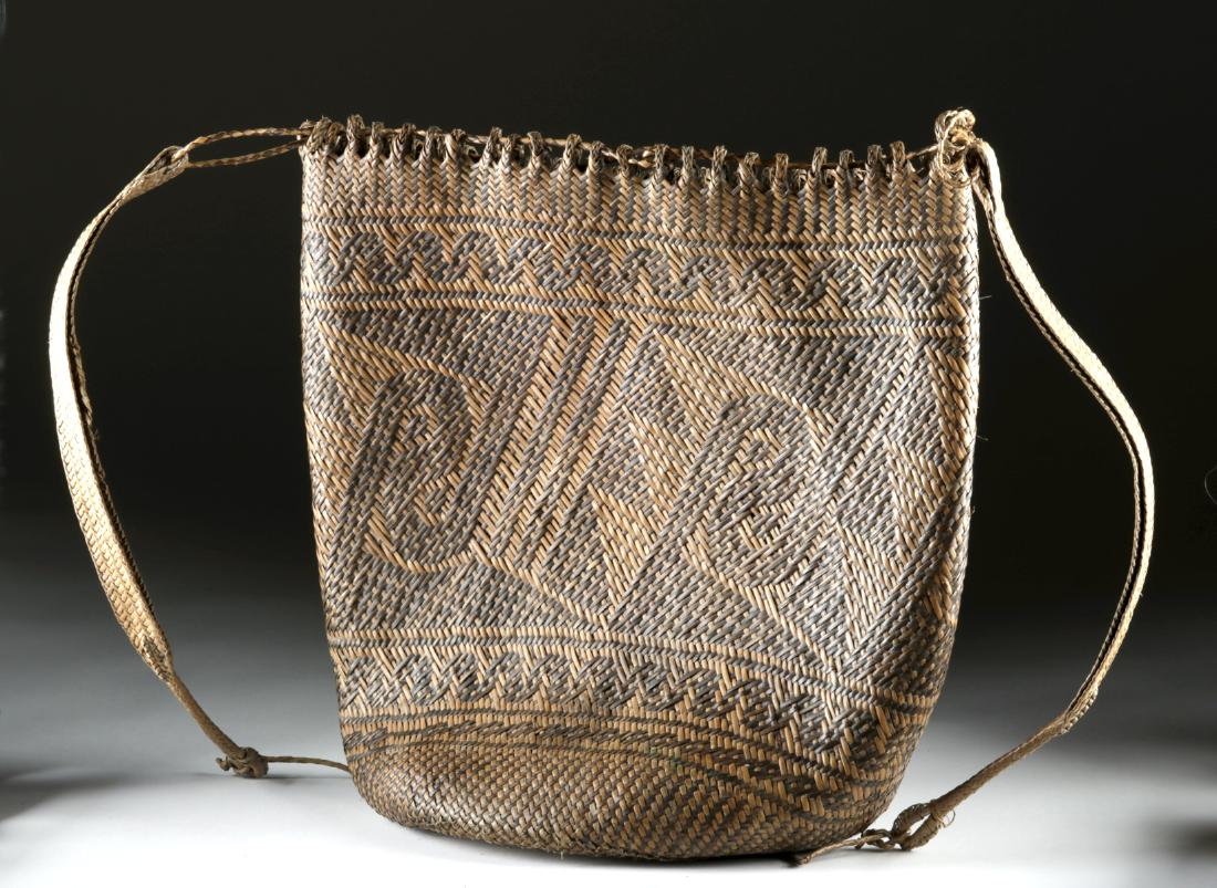20th C. Balinese Woven Fiber Basket: Southeast Asia, Indonesia, Bali, ca. mid 20th century CE. A handsome woven fiber basket, made in the traditional style of the native Balinese. Alternating dark and light fibers create a repeated geome