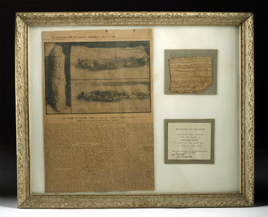 Framed Egyptian Mummy Wrapping Fragment + News Article: Ancient Egypt, Middle Kingdom Period, 12th Dynasty, ca. 1991 to 1806 BCE. A small fragment of tightly-woven linen used as wrappings for the mummy of Khnumu-Nekht (sometimes Khnumu-Nakht). Khnumu-Nekht