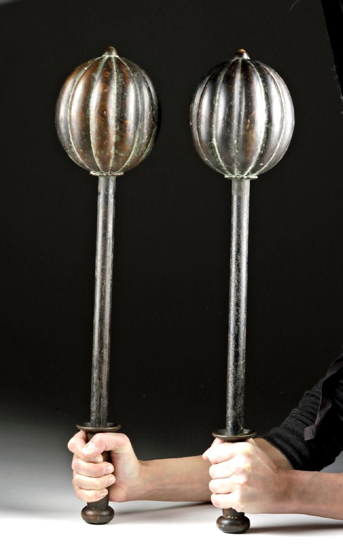 Two 18th C. Persian Wood, Iron & Brass Horseman Clubs: Near East, Iran, Persian Empire, ca. 18th century CE. A fine matched pair of beautiful horseman clubs, each with a cylindrical wooden handle, a discoid hand guard, and a rounded pommel. A lengthy iron