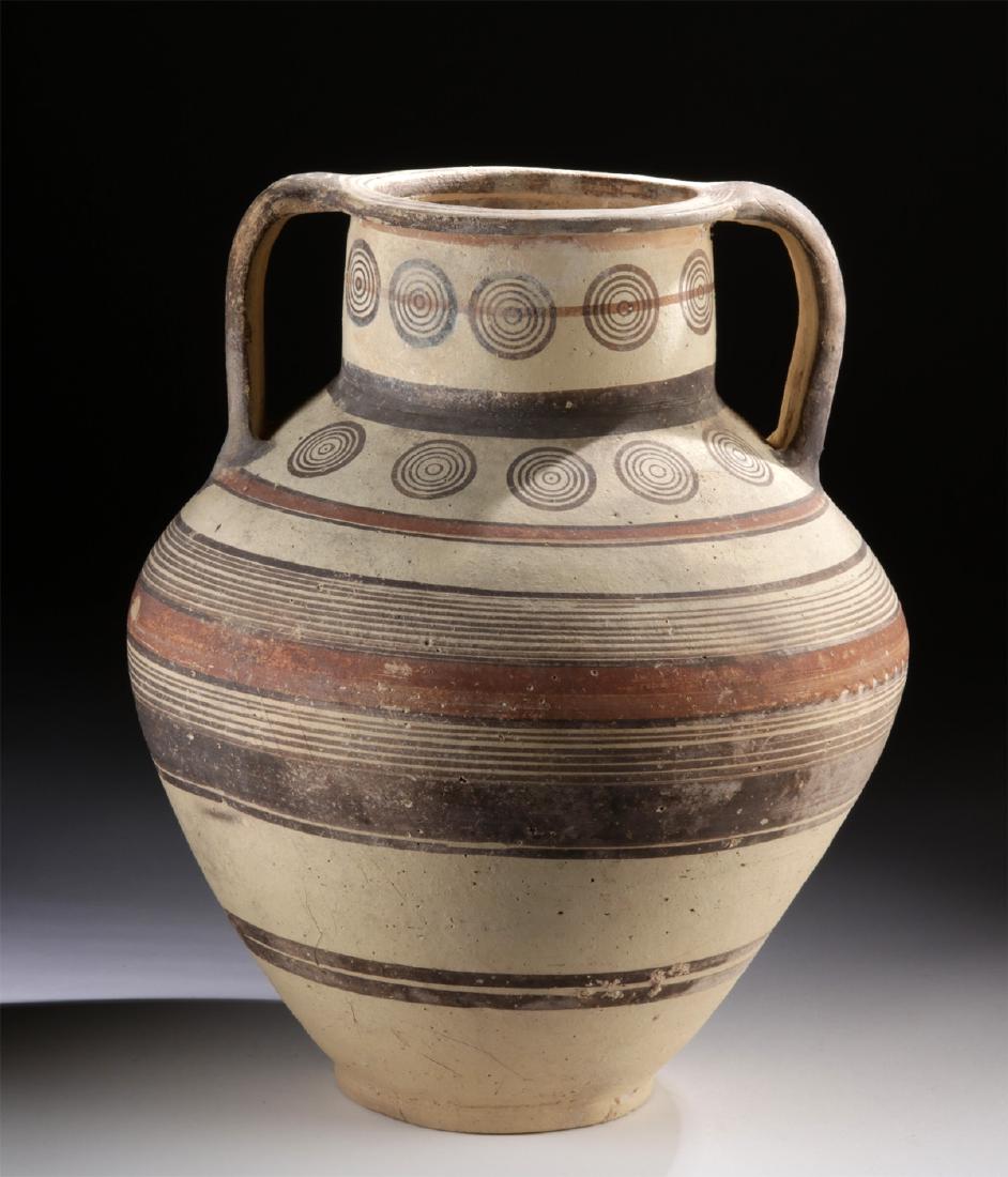Large Cypriot Polychrome Amphora w/ TL: Ancient Greece, Cyprus, Late Cypriot III, ca. 1200 to 1050 BCE. A gorgeously preserved, wheel-thrown terracotta amphora with a protruding ring foot, a globular body with a gently rounded shoulder, a c