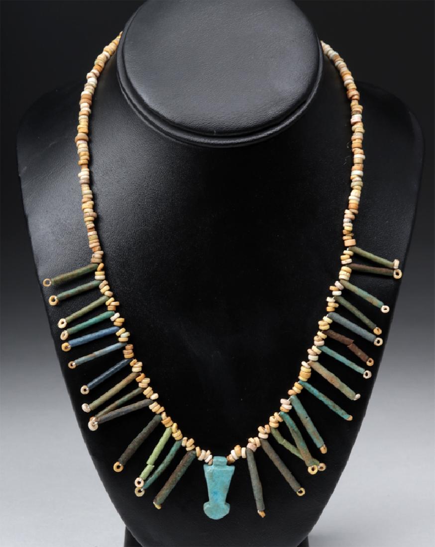 Egyptian Faience Necklace w/ Menat Amulet: **Originally Listed At $350** Ancient Egypt, Late Period, ca. 664 to 332 BCE. A pretty collection of ancient dark green faience tube beads and pale brown/ocher yellow faience seed beads, strung using 