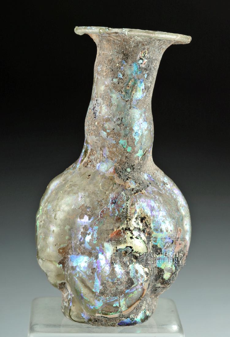 Rare Roman Glass Janus-Headed Flask: **Originally Listed At $1000** Roman, Imperial Period, ca. 1st to 2nd century CE. A stunning and semi-translucent Janus-headed flask, mold-formed from a pale-yellow glass. The striking vessel is defin