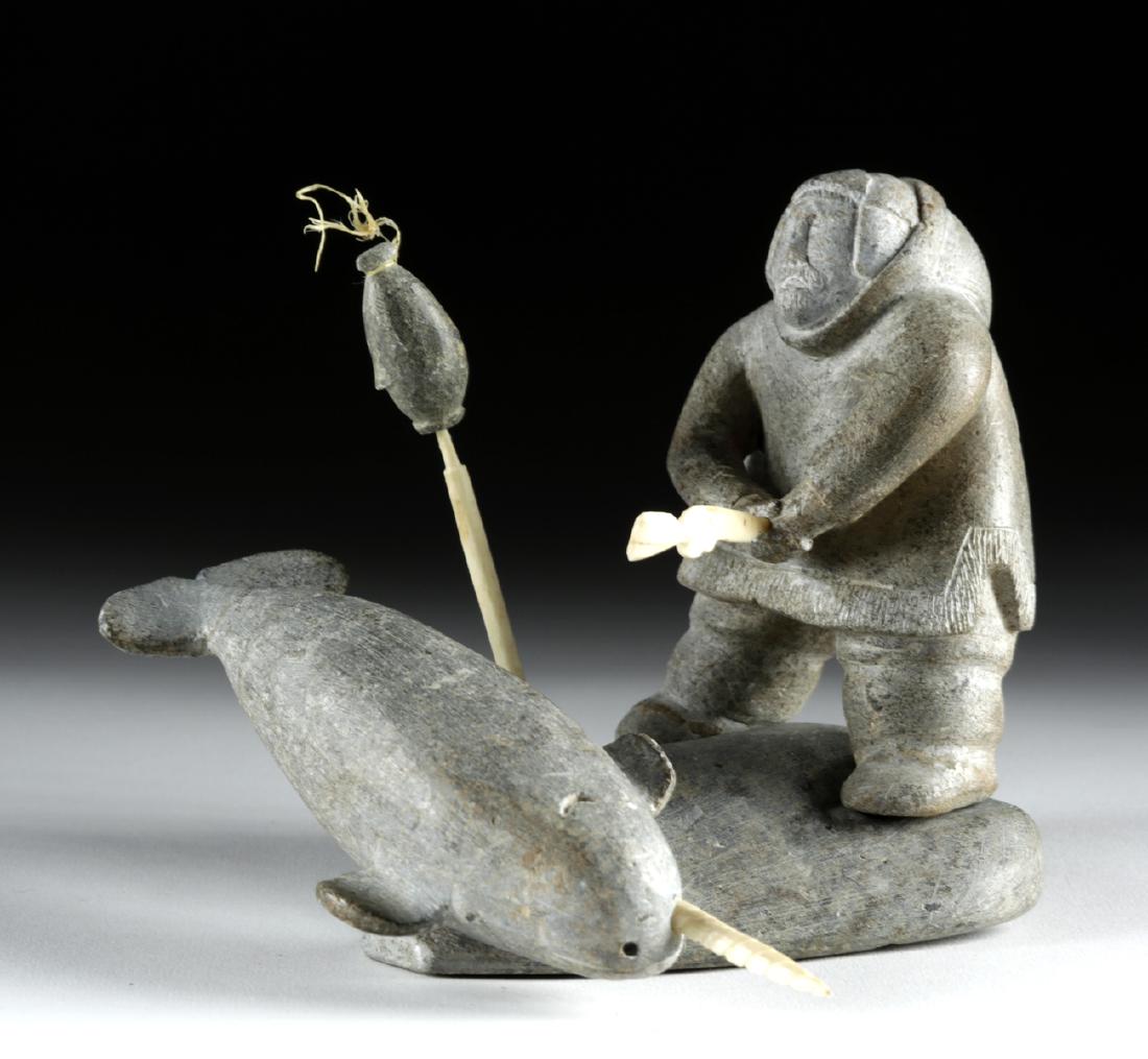 20th C. Inuit Stone & Walrus Ivory Carving: **Originally Listed At $150** Native American/First Nations, Arctic region, Inuit peoples, ca. mid 20th century CE. A fun soapstone carving depicting a hunter, bundled in carved stone clothing, holdin