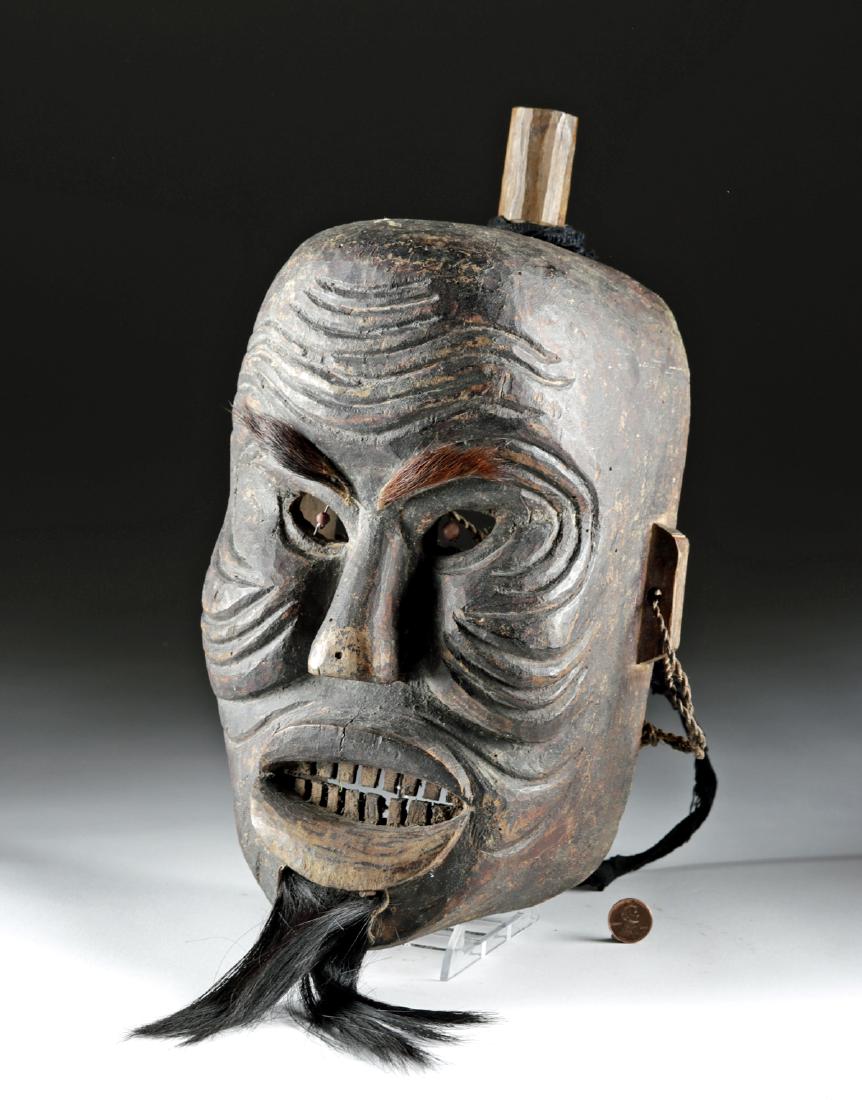 19th C. Chinese Wooden Yao Priest / Shaman Mask: East Asia, China to northern Thailand, ca. late 19th century CE. A hand-carved wooden Yao priest/shaman mask which has been carved out on the verso for wear. The expressive, brown-painted visage is co