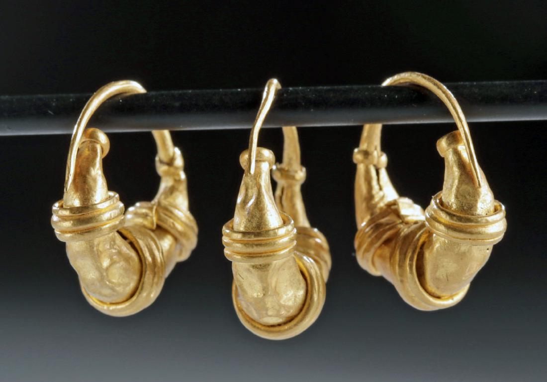 Lot of 3 Roman Gold Banded Crescent Earrings - 3.3 g: Roman, Imperial Period, ca. 1st to 3rd century CE. A fine trio of 94% gold hoop earrings (equivalent to 22K+), each nearly circular with a hollow, crescent-moon shaped motif on their lower side wrappe