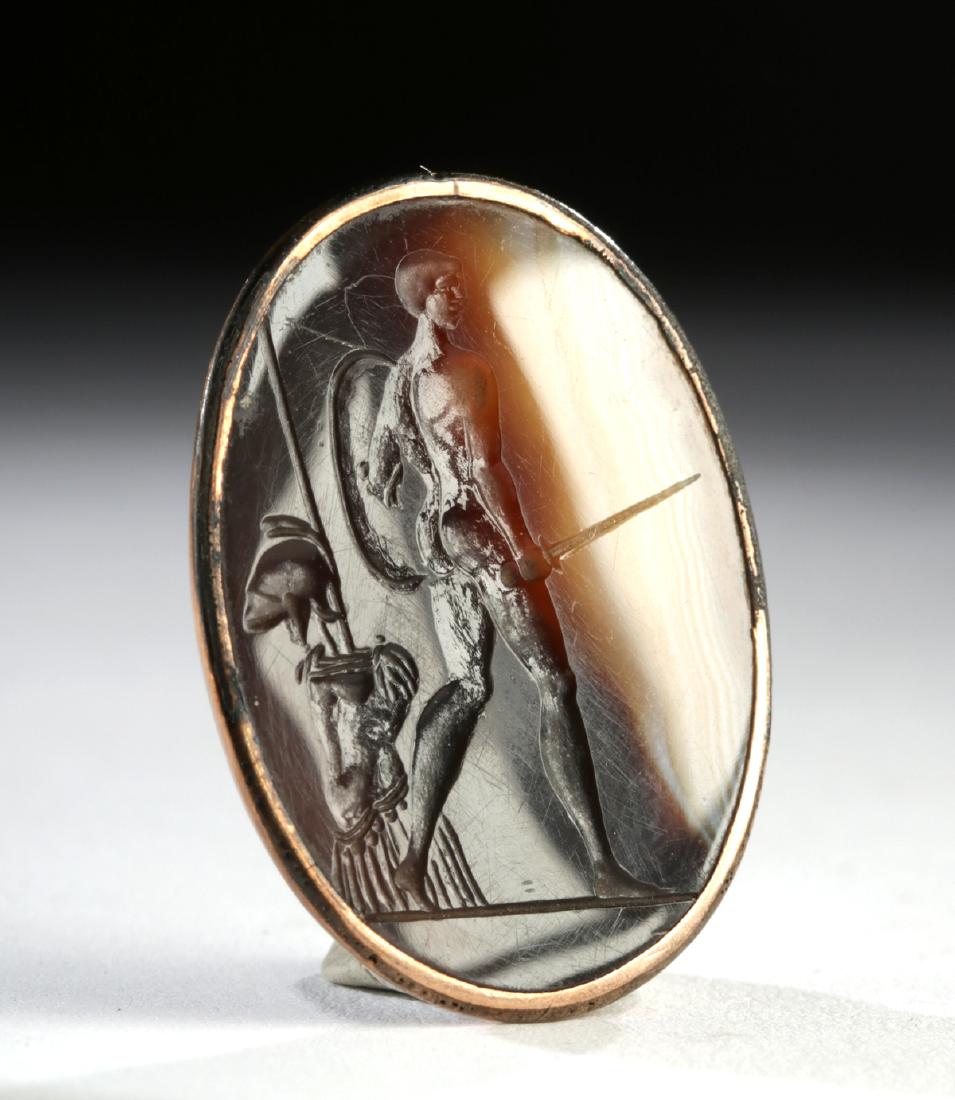 19th C. European Agate Intagio - Striding Warrior: Europe, Victorian Period, ca. 19th century CE. A sizable ovoid agate intaglio pendant of gorgeous chocolate brown, caramel, and white hues, depicting a nude striding warrior wielding a shield and an i