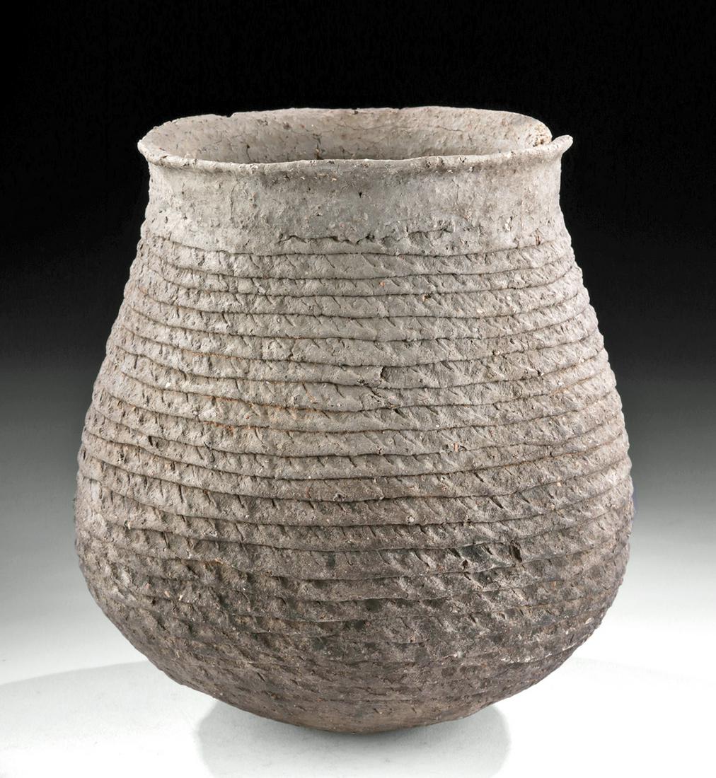 Mogollon Corrugated Pottery Olla - Mesa Verde Museum: North America, Southwestern New Mexico, Southeast Arizona, and Northern Chihuahua region of Mexico, Mogollon culture, ca. 1000 to 1150 CE. An intriguing hand built grey pottery olla of a rounded form 