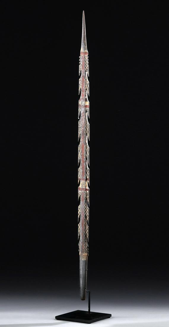 Early 20th C. Australian Aboriginal Wooden Spear Tip: Oceania, Southern Australia, Aboriginal peoples, ca. early to mid 20th century CE. A hand-carved wooden spear tip of a slender form with a narrow tang, a thin blade, eighteen downward-facing barbs, an