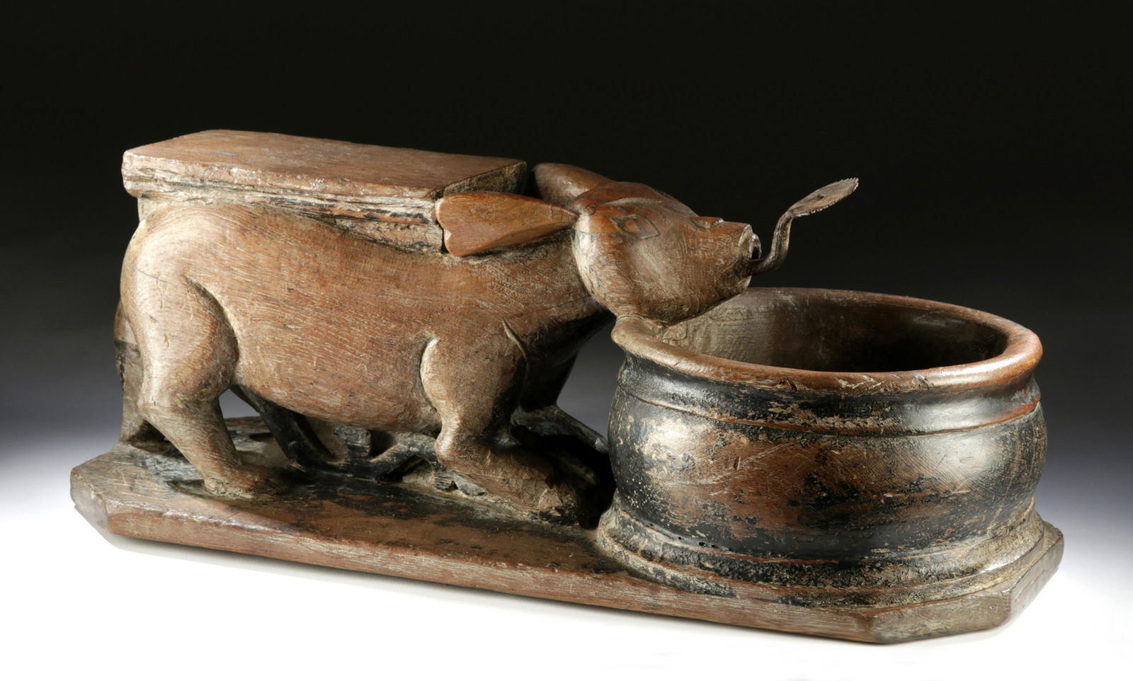 19th C. Southeast Asian Wooden Coconut Grater w/ Bowl: Southeast Asia, Thailand or Cambodia, ca. second half of the 19th century CE. A lovely hand-carved wooden coconut grater in the form of a rabbit standing atop four bent legs. The stocky abdomen is sur