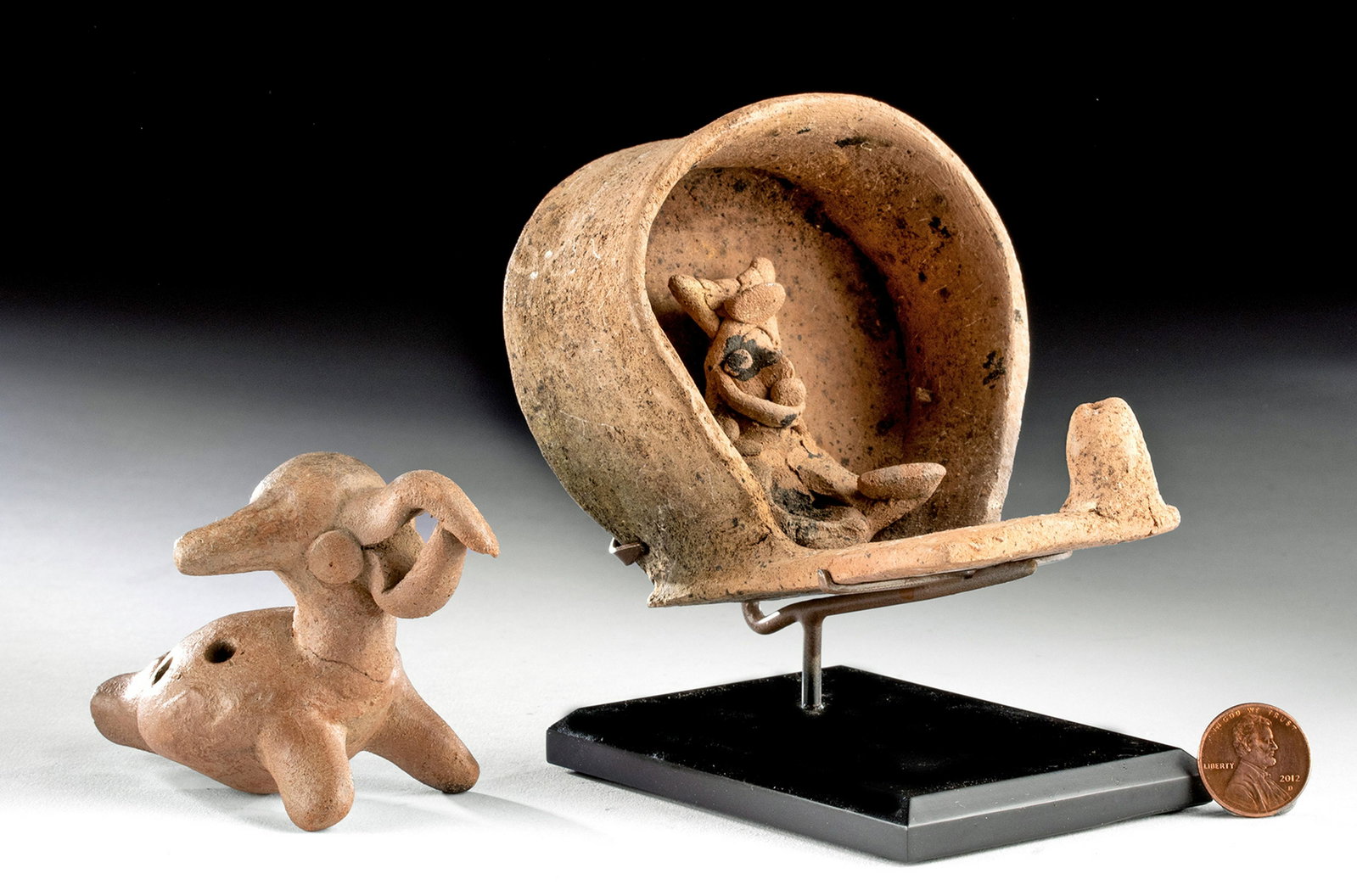 Lot of 2 Colima Terracotta Pieces: Pre-Columbian, West Mexico, ca. 300 BCE to 300 CE. A nice pair of Colima pottery pieces, including a handbuilt, 4-tone ocarina depicting a zoomorph (perhaps a coatimundi or a tapir given those ears an