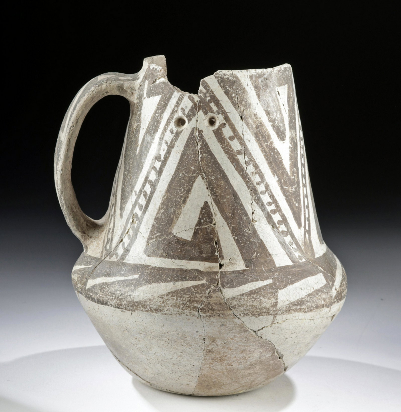 Anasazi Pottery Pitcher - Mesa Verde Museum: Native American, Southwestern USA, Colorado or New Mexico, Anasazi/Ancestral Puebloans, ca. 1100 to 1300 CE. A wonderfully formed ceramic pitcher with stylized geometric motifs in the black-on-white M
