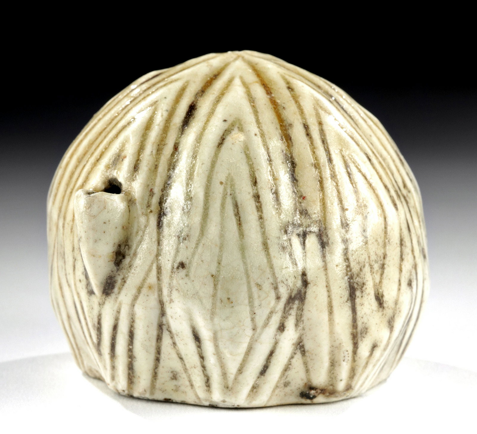 19th C. Korean Porcelain Water Dropper - Melon Shaped: East Asia, Korea, Joseon Dynasty, ca. 19th century CE. A charming porcelain water dropper in the form of a Korean melon, a golden-colored fruit cultivated in eastern Asia. In Korea, the fruit was - an