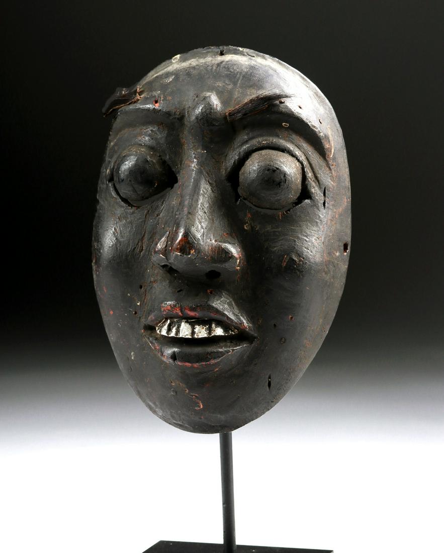 20th C. Indonesian Lombok Painted Wood Mask w/ Hair: Southeast Asia, Indonesia, Lombok Island, ca. early to mid 20th century CE. A hand-carved wooden mask depicting an expressive and highly stylized anthropomorphic face. The countenance presents with bu