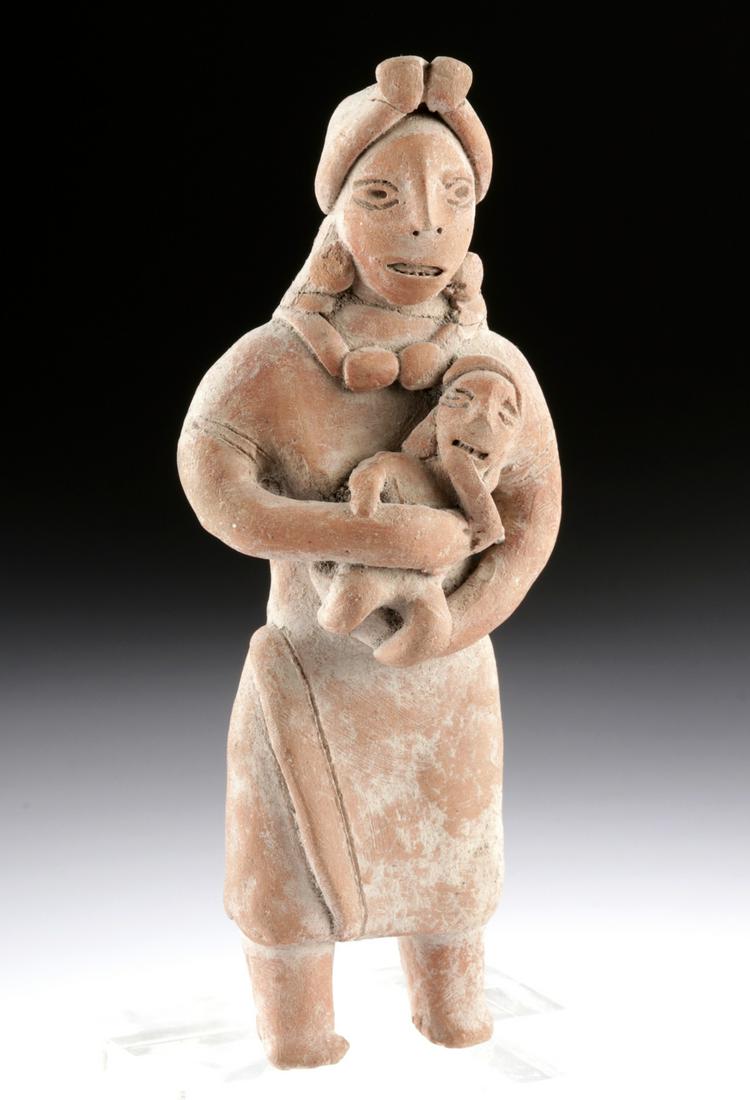 Pre-Columbian Autlan Terracotta Mother & Child: Pre-Columbian, West Mexico, Jalisco/Colima, Autlan type, post-Classic era, ca. 1300 to 1500 CE. An endearing statue of a mother cradling her infant in her arms. Both mother and child look out at the v