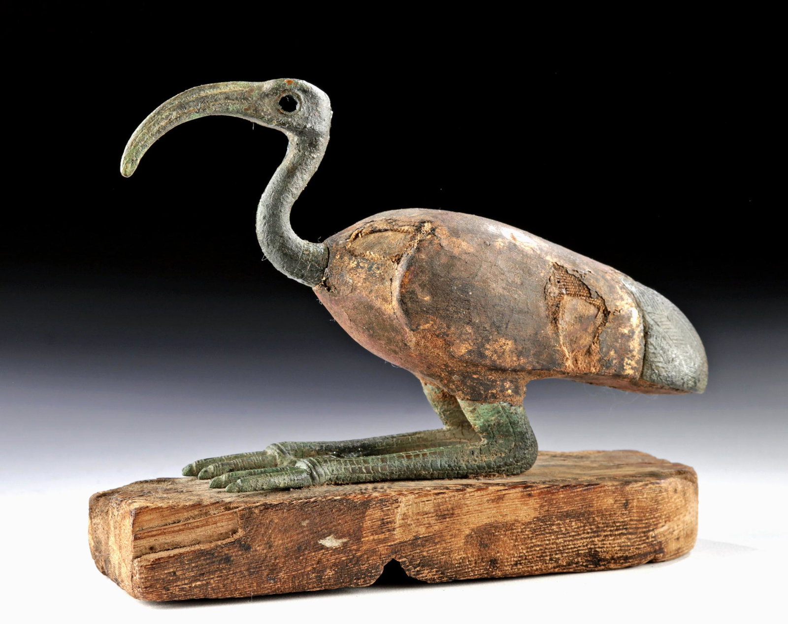Egyptian Bronze / Gesso Wood Sacred Ibis - XRF Tested: Ancient Egypt, Third Intermediate to Late Dynastic Period, ca. 1070 to 332 BCE. A sacred ibis, similar to ones found in the tombs of scribes, associated with the deity Djehuty or Thoth, the god of kno