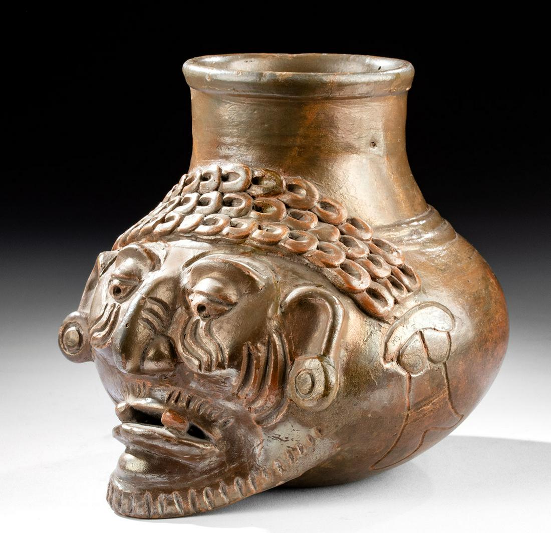 Gorgeous Maya Plumbate Ware Pottery Portrait Vessel: Pre-Columbian, Southern Mexico to Guatemala, Southern Lowlands, Maya, Late Classic Period, ca. 600 to 900 CE. A hand-built brownware pottery jar of a wondrous form covered in a lustrous glaze known as