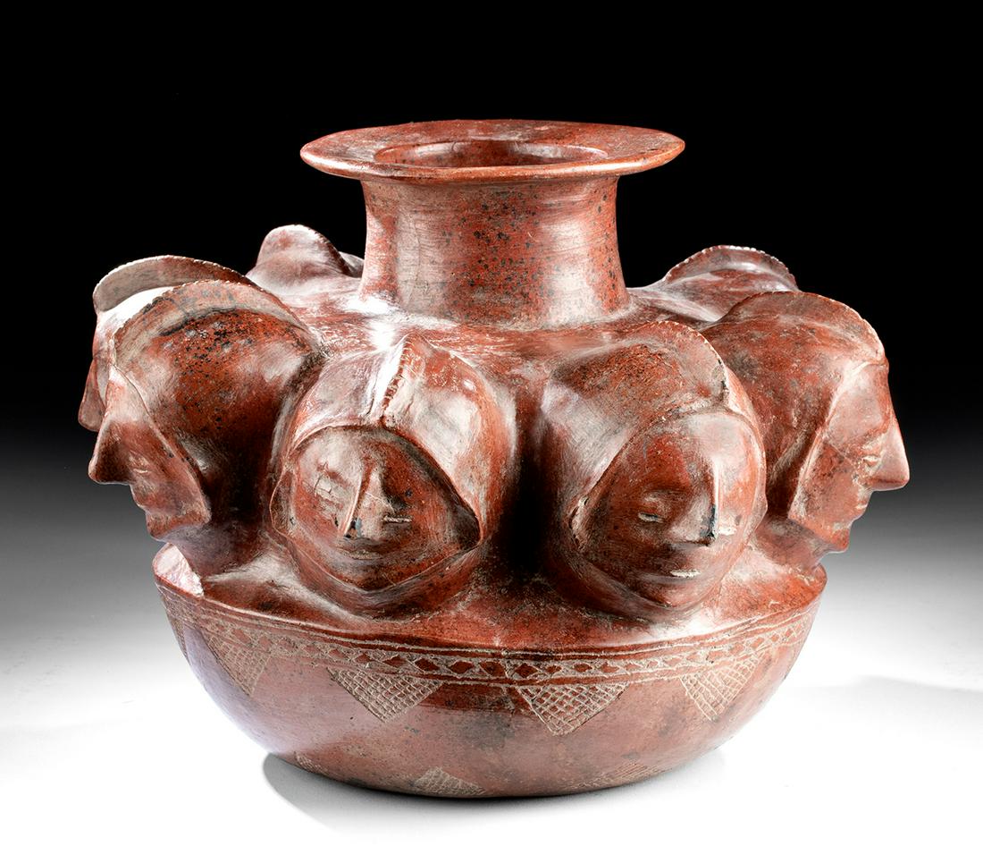 Superb Colima Pottery Vessel - 8 Heads w/ Helmets: Pre-Columbian, West Mexico, Colima, ca. 300 BCE to 300 CE. A wonderful Colima redware vessel with eight heads wearing crested helmets incised with notches on the crests, their visages presenting caref