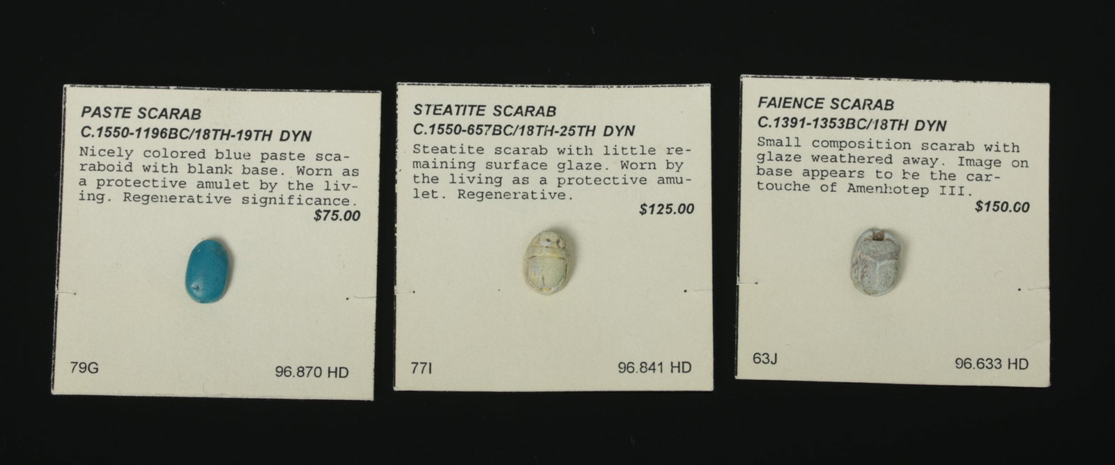 Trio of Egyptian Scarabs - Ex-Philip Mitry: **First Time At Auction** Ancient Egypt, New Kingdom to Third Intermediate Period, ca. 1550 to 664 BCE. A trio of Egyptian miniature amulets, two scarabs and one scaraboid, each made from a different 