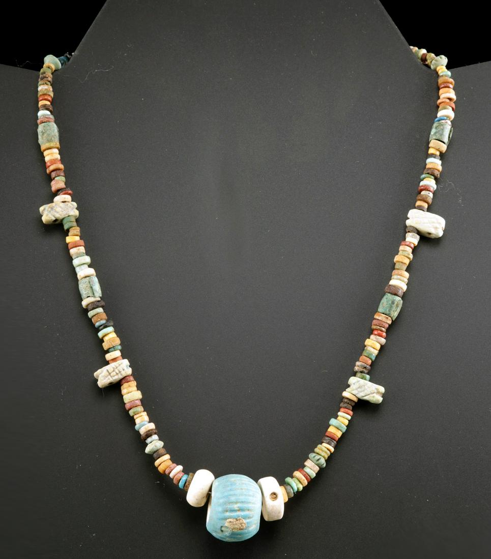 Egyptian Faience Bead Necklace w/ Pretty Pendant: **First Time At Auction** Ancient Egypt, Third Intermediate to Late Dynastic Period, 21st to 31st Dynasty, ca. 1076 to 332 BCE. A gorgeous necklace of a wearable form composed of dozens of petite glaz