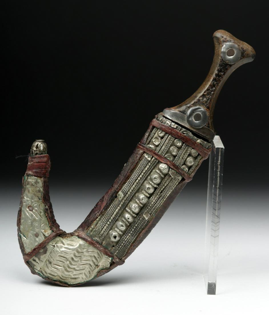20th C. Jambiya Curved Knife & Sheath: **First Time At Auction** Middle East, Yemen or Saudi Arabia, ca. 20th century CE. A beautiful Jambiya knife similar to that carried by the fabled Lawrence of Arabia. The steel metal blade has a curve
