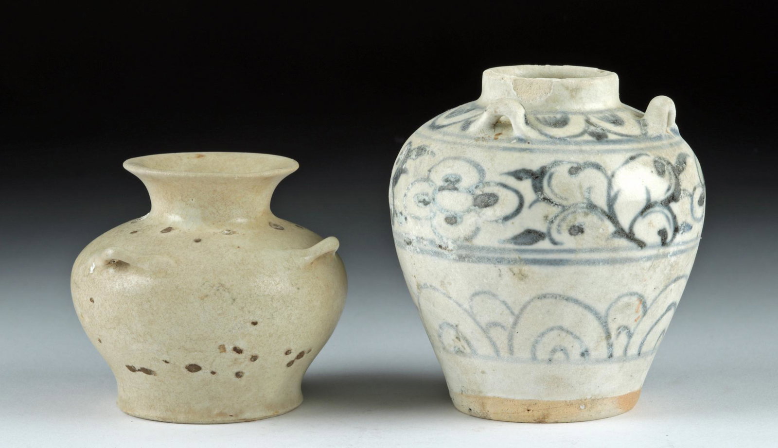 Lot of Two 15th C. Vietnamese Hoi An Hoard Pottery Jars: **First Time At Auction** Southeast Asia, Vietnam, ca. 15th century CE. A fine set of two glazed pottery jars from the famous Hoi An Hoard. The smaller vessel has a squat form with a circular base, a 