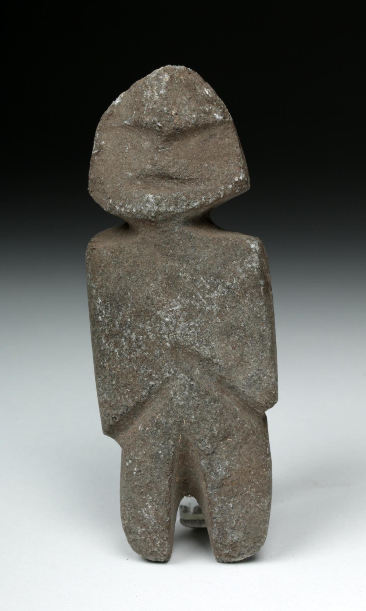 Guerrero Mezcala Stone Axe God: **First Time At Auction** Pre-Columbian, Mexico, Guerrero, Mezcala, ca. 400 to 100 BCE. A lovely hand-carved anthropomorphic standing axe god figure, carved from a mottled gray hardstone with reflecti