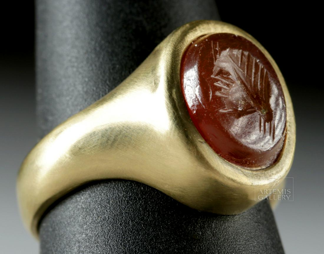 14K+ Gold Ring w/ Roman Glass Intaglio Man's Profile: **Originally Listed At $400** Roman, Imperial Period, ca. 2nd to 4th century CE. A lovely ovoid carnelian intaglio of warm vermilion hues with sloping edges and depicting an incised of a man's head fa