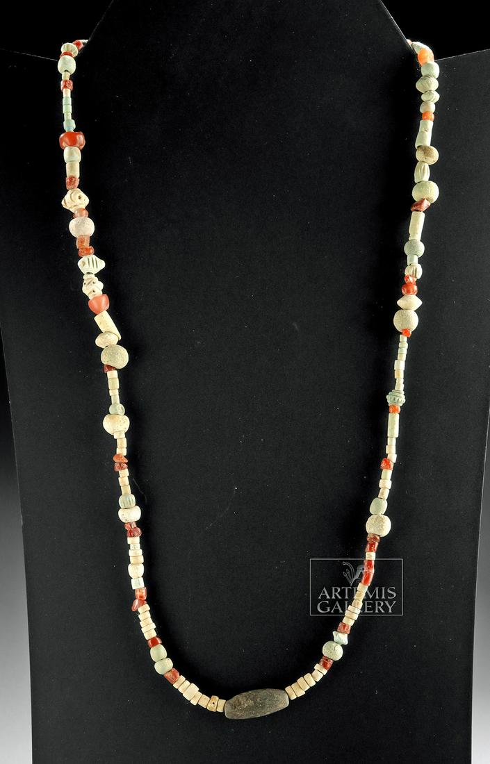 Ancient Parthian Carnelian & Faience Beads Necklace: **Originally Listed At $150** Near East, Persia, Parthian Empire, ca. 247 BCE to 224 CE. A pretty necklace comprised of dozens of ancient round carnelian beads, dozens of round, tubular, and disc-shap