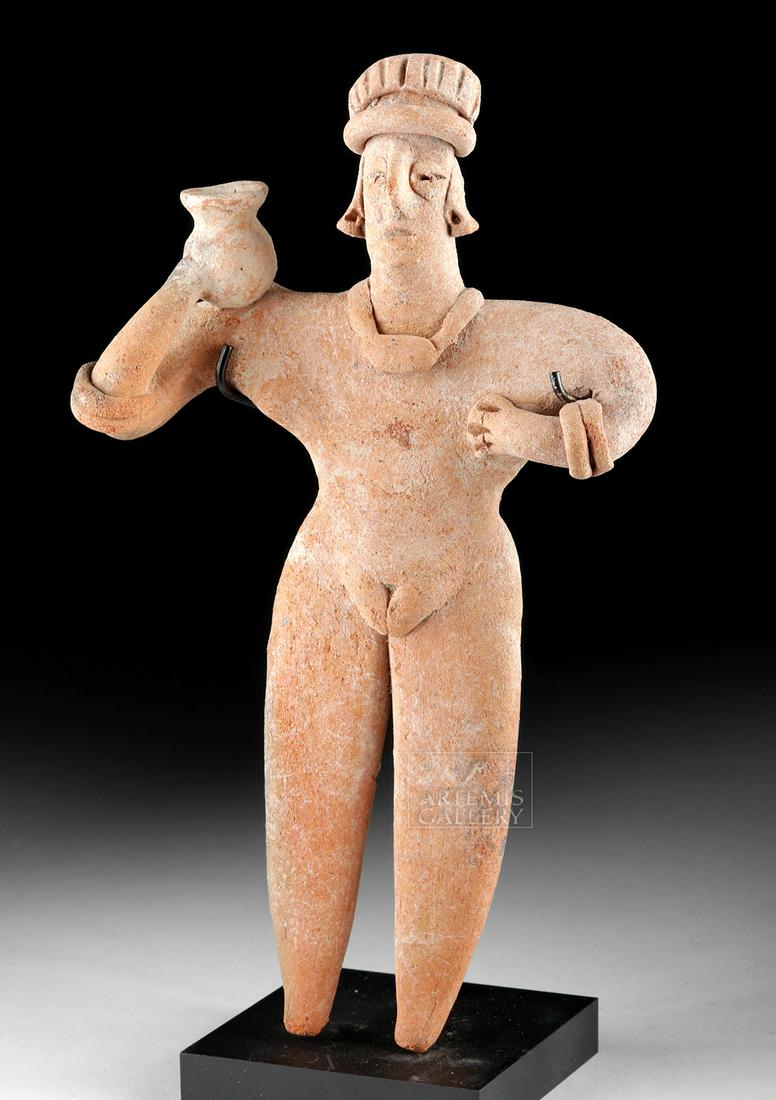 Colima Pottery Standing Flat Figure w/ Jar: **Originally Listed At $300** Pre-Columbian, West Mexico, Colima, Protoclassic Period, ca. 100 BCE to 250 CE. A hand-built pottery female figure of a characteristically 'flat' form standing upon lengt