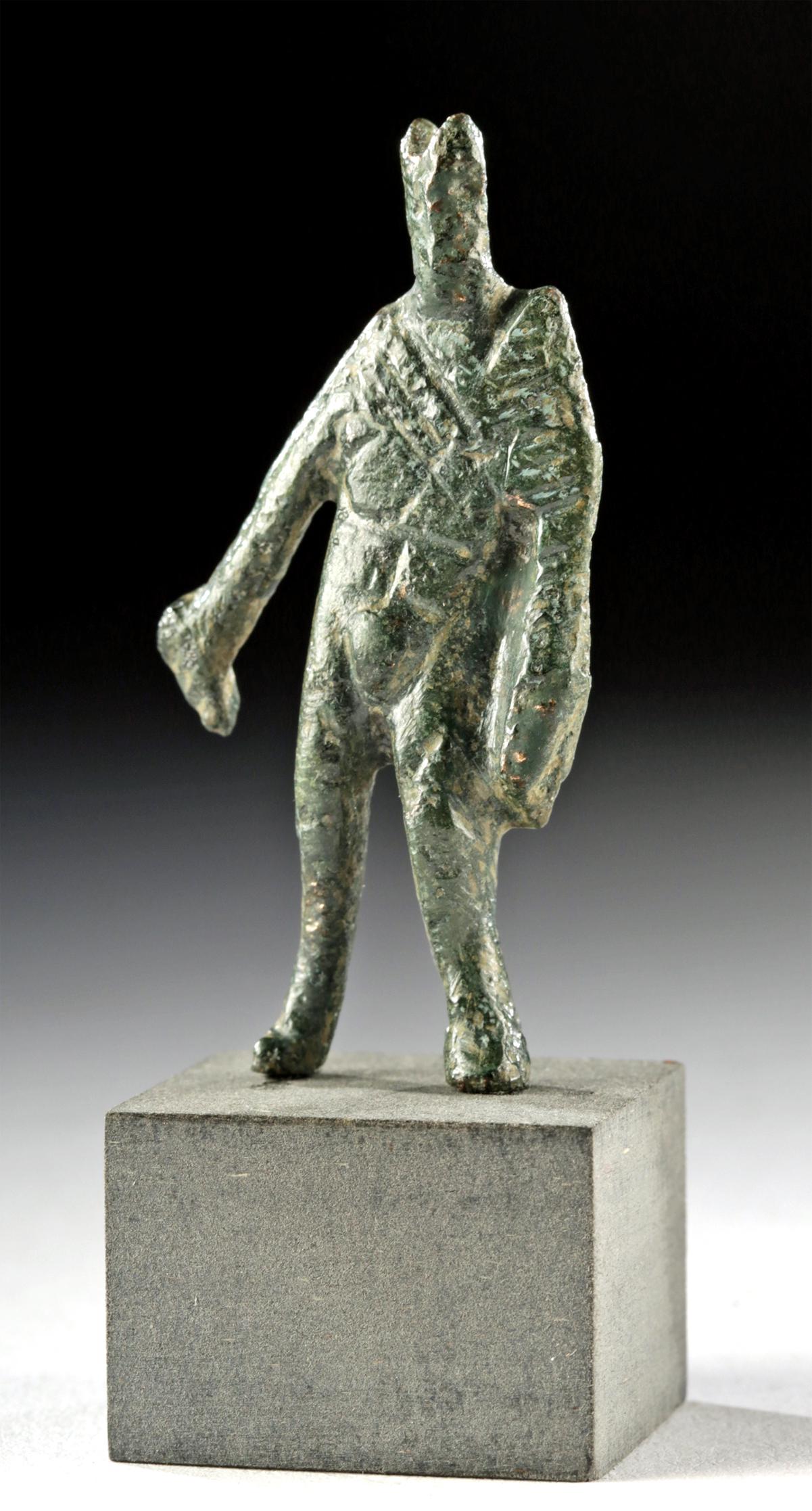Miniature Roman Bronze Statuette of Mercury: **Originally Listed At $300** Roman, Imperial Period, ca. 1st to 3rd century CE. A miniature, solid leaded bronze statue of Mercury (Greek Hermes) depicted standing and holding his caduceus against hi