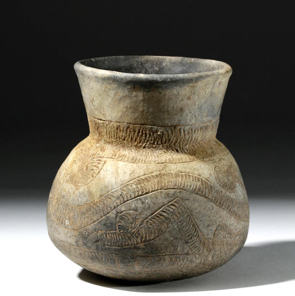 Ancient Thai Ban Chiang Incised Pottery Vessel: **Originally Listed At $125** Southeast Asia, Thailand, Ban Chiang culture, ca. 1st millennium BCE. A round-bodied ceramic jar with a wide, flaring neck and rolled rim. The exterior body and lower nec