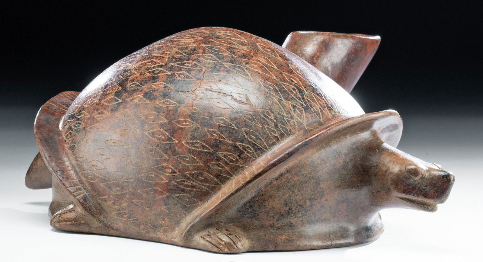 Rare West Mexican Colima Redware Turtle: Pre-Columbian, West Mexico, Colima, ca. 300 BCE to 300 CE. A fascinating and rare vessel in the form of a turtle, with incised lines marking the feet and giving a diamond pattern to the shell. The tur