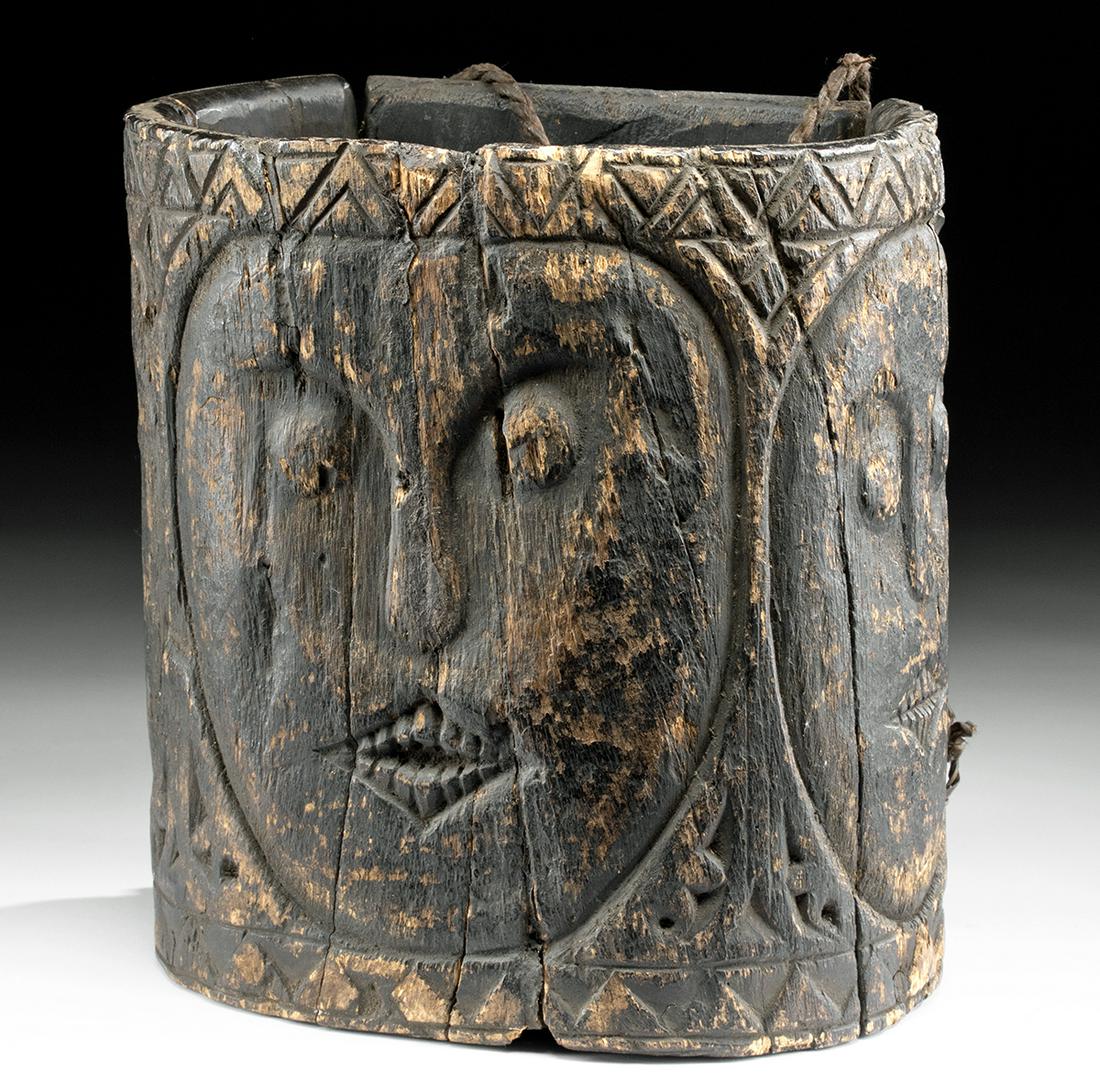 Early 20th C. Borneo Dayak Wood Tool Container w/ Faces: Southeast Asia, Indonesia, Borneo, Kalimantan, Dayak, ca. early 20th century CE. A substantive wooden tool container of an ovoid form, finely carved with three abstract anthropomorphic faces that like