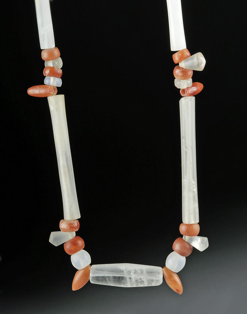 Tairona Quartz and Carnelian Necklace: Pre-Columbian, Columbia, Tairona culture, ca. 800 to 1000 CE. A stunning necklace comprised of 43 carnelian and quartz crystal beads (the vast majority of which are ancient Tairona) arranged in an att