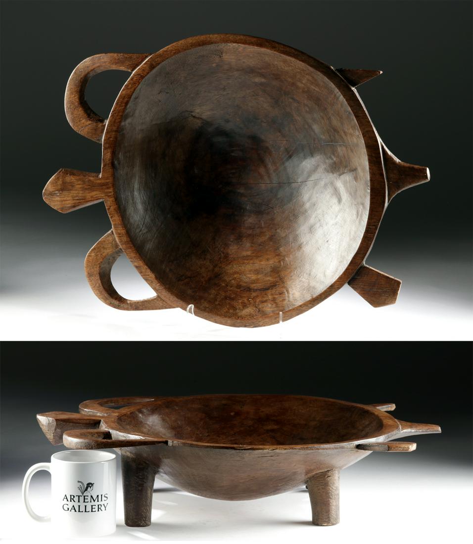 Rare 19th C. Fijian Wood Kava Bowl - Sea Turtle Form: Oceania, Fiji Islands, Viti Levu Island, ca. 19th century CE. A very rare and lovely bowl, hand-carved from finely grained wood, in the form of a sea turtle supported by four tubular legs and featurin