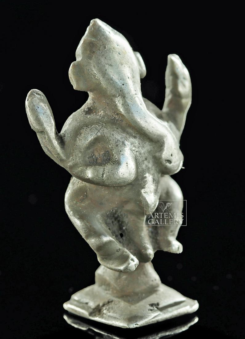 Miniature 19th C. Indian Silver Figure - Ganesha: Central Asia, India, late 19th to early 20th century CE. A solid silver miniature depicting Ganesha, one of the best-known and most worshipped deities in the Hindu pantheon. Although he is known by ma