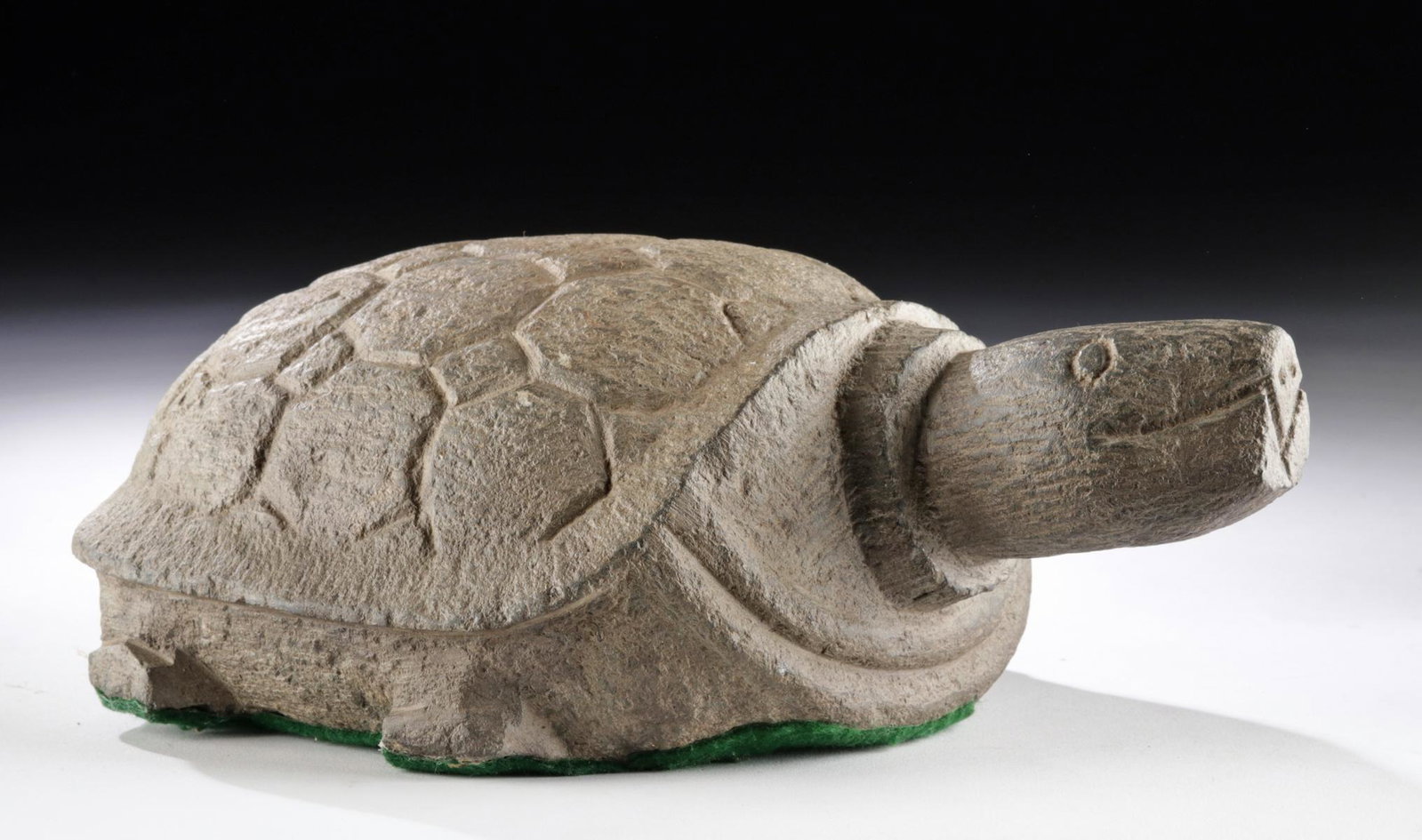 Chinese Ming Dynasty Stone Tortoise: East Asia, China, Ming Dynasty, ca. 1368 to 1644 CE. An intriguing tortoise of a sturdy form, hand-carved from grey-hued hardstone. The animal exhibits a quartet of attenuated legs, a domed shell ador