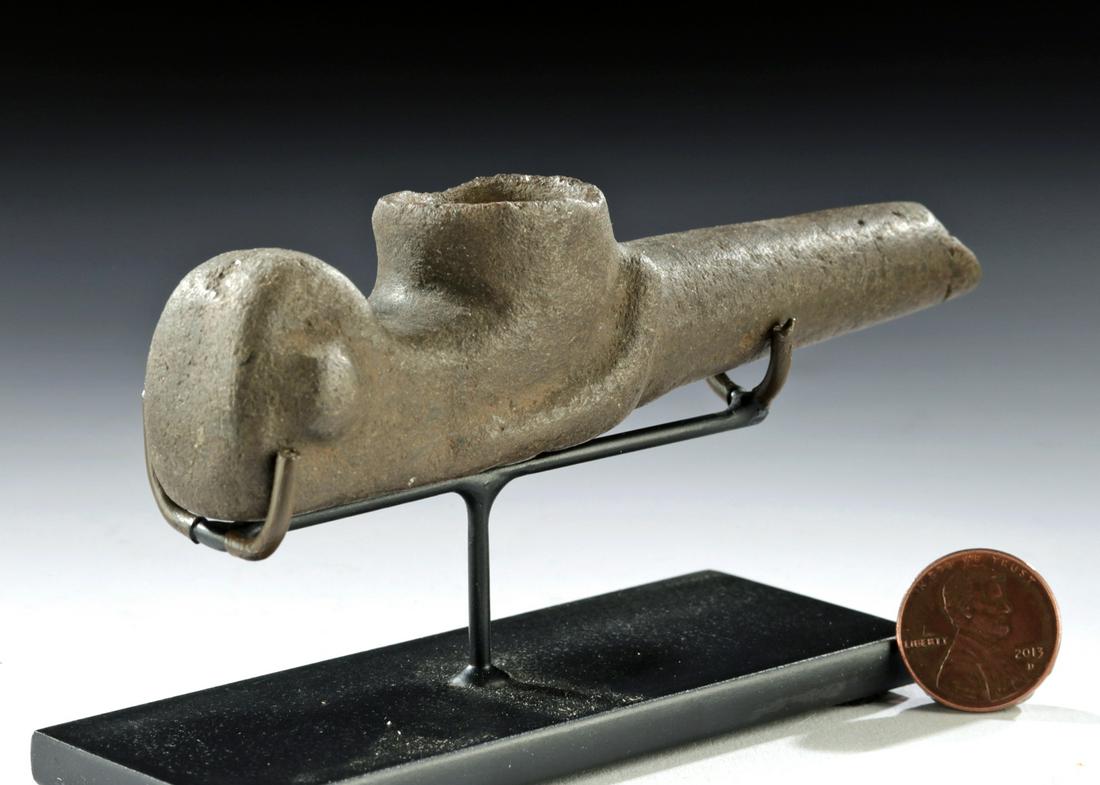 Mapuche Stone Pipe - Abstract Zoomorphic Form: Pre-Columbian, northern Chile, Mapuche people, ca. 1500 CE. A hand-carved stone pipe of a slender form with a narrow mouthpiece, a central receptacle, and a bulbous handle. The pipe is shaped to resem
