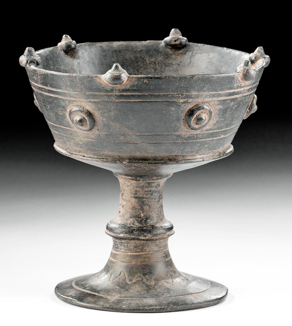 Etruscan Bucchero Pottery Stemmed Chalice: Classical World, Northern Italy, Etruscan culture, ca. 7th to 6th century BCE. A wonderful wheel-thrown blackware pottery chalice of a fine form meant to be deposited into a grave as a funerary offeri