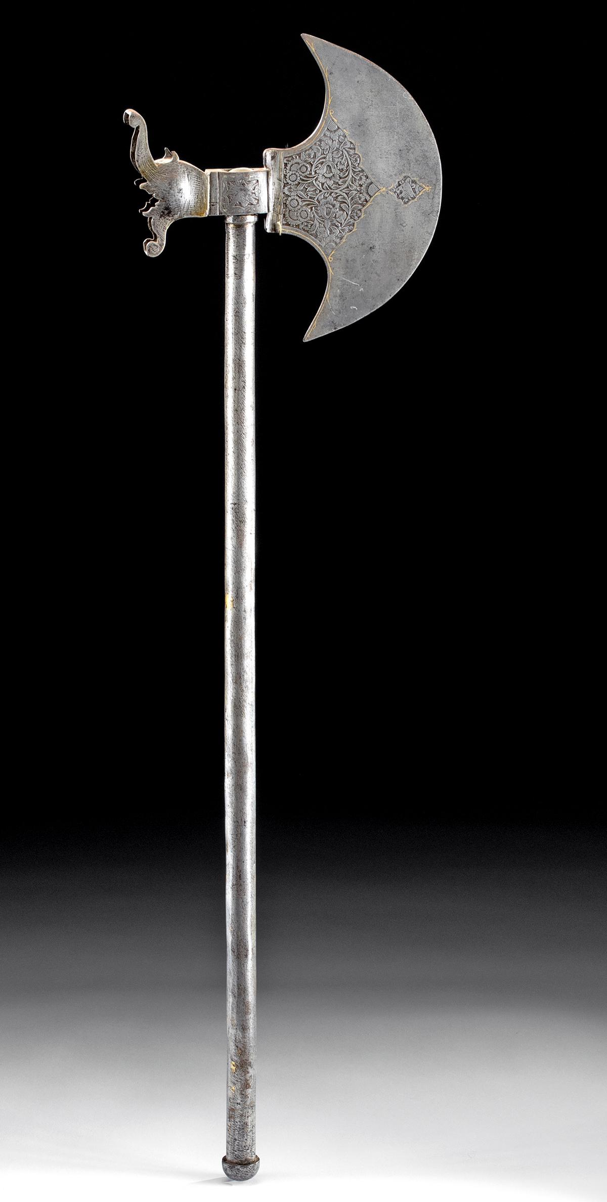 19th C. Indo-Persian Steel Battle Axe w/ Gilt Details: Central Asia, India/Pakistan, Indo-Persian culture, ca. 19th century CE. A fine battle axe constructed from four attached steel components. The forged axe head bears a crescent blade with projecting t