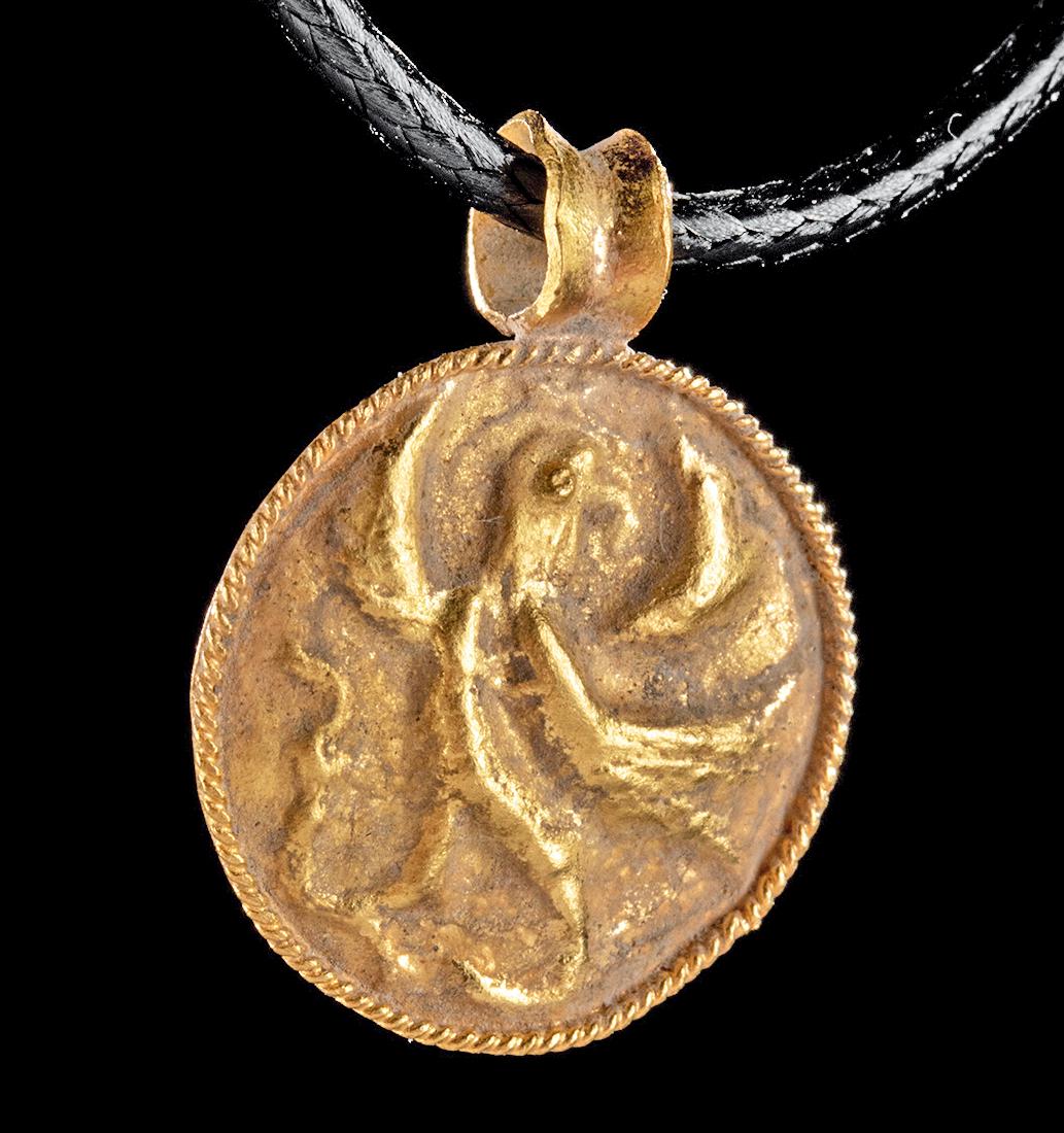 Roman 22K+ Gold Pendant w/ Repousse Eagle - .9 g: Roman, Imperial Period, ca. 1st to 3rd century CE. A lovely 98% gold (equivalent to 22K+) coin-shaped pendant with a repousse image of an eagle taking flight in front of a crescent moon on its front-f