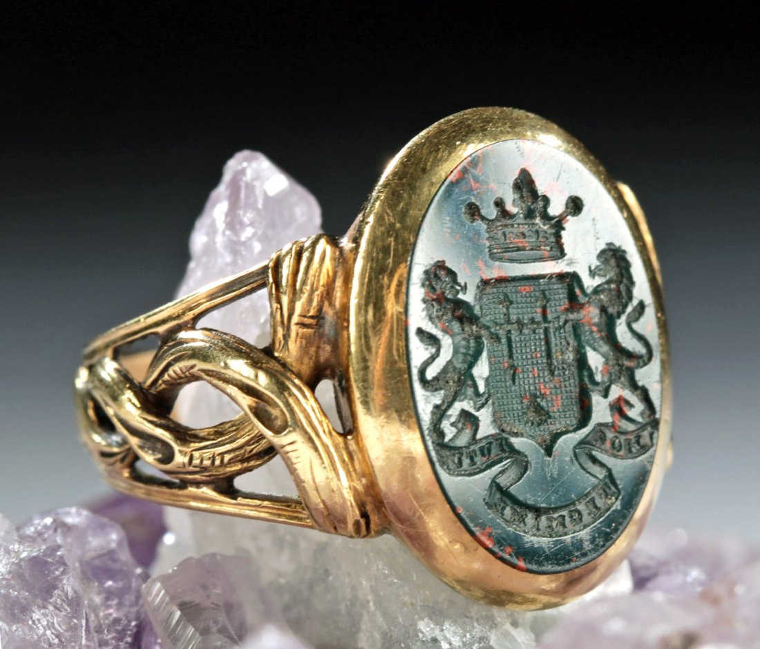 19th C. German 18K Gold Signet Ring Bloodstone Intaglio: Central Europe, Germany/Austria, ca. 19th century CE. A remarkable, beautifully preserved 18K gold signet ring with its band made of entwined gold that resembles a twisted grapevine. Set into the ring