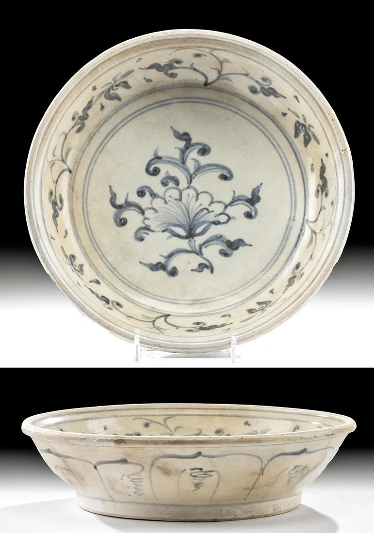 Vietnamese Hoi An Glazed Pottery Dish: Southeast Asia, modern day Vietnam, Annamese (sometimes Anamese), ca. 15th century CE. A graceful porcelain dish with shallow sides, a slightly thickened rim, and a low, wide disc foot. The interior a