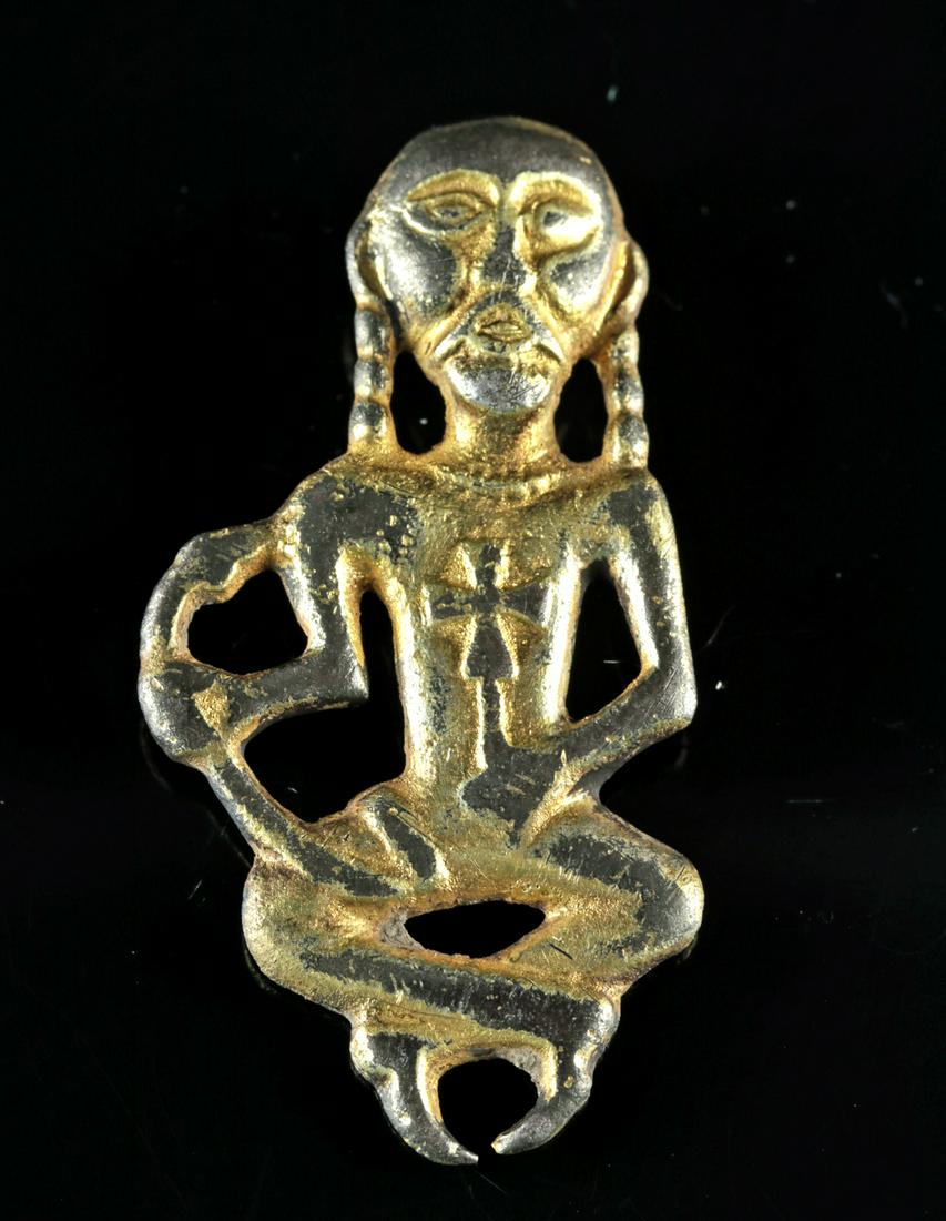 Viking Gilt Silver Odin Applique - 8.9 g: **Originally Listed At $500** Northern Europe, Viking/Norse culture, ca. 1000 CE. A repousse silver-gilt applique depicting a facing figure of Odin, modeled sitting cross-legged holding a serpent and