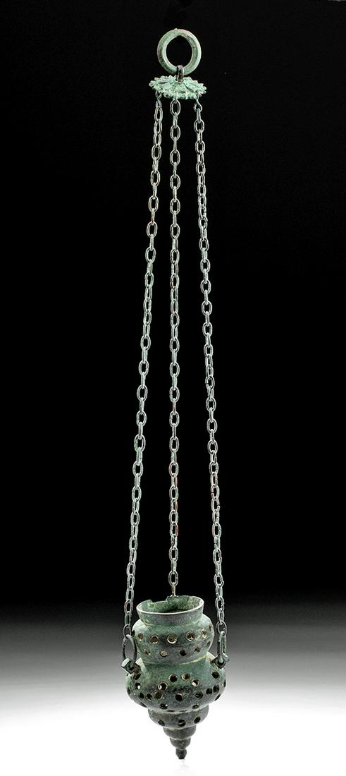 Fine Byzantine Bronze Hanging Censer w/ Chains: **First Time At Auction** Ancient Near East, Holy Land, early Byzantine Empire, ca. mid-5th to 6th century CE. A wonderful cast-bronze censer of a multi-tiered, drop-form profile with dozens of perfor