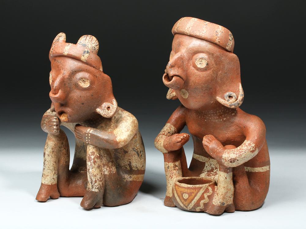 Nayarit Bichrome Pottery Seated Figures (pr): **Originally Listed At $2000** Pre-Columbian, Western Mexico, Nayarit, Ixtlan del Rio, ca. 300 BCE to 300 CE. A wonderful pair of matched male and female terracotta figures with characteristically wid