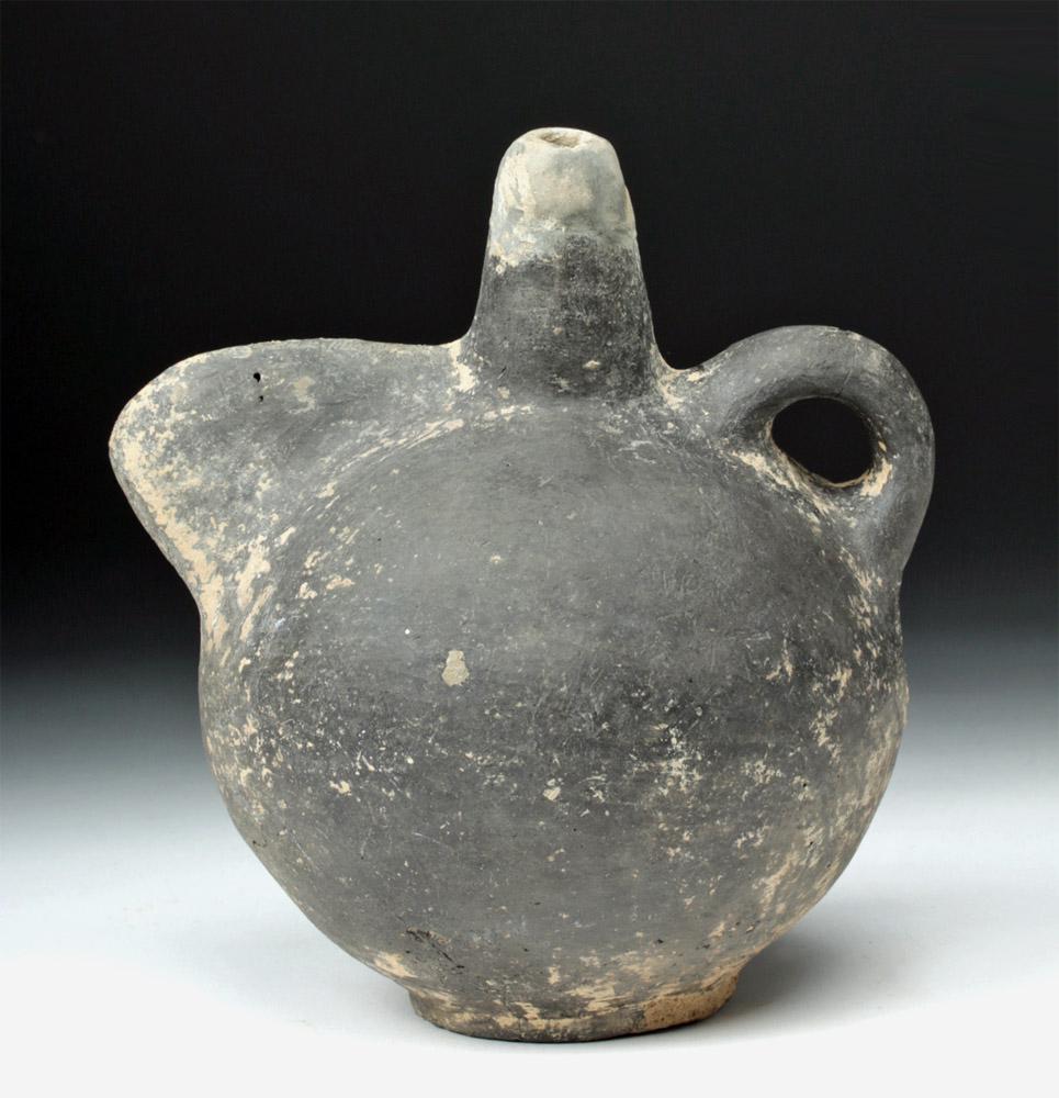 Central Asian Terracotta Pouring Vessel - TL Tested: **Originally Listed At $800** Central Asia, Bronze Age, ca. 2nd to early 1st millennium BCE. A fascinating and rare vessel, made of heavy blackware, with a rounded, teapot-like body, a round ring foot