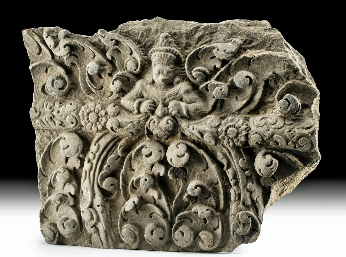 12th C. Khmer Stone Temple Fragment w/ Garuda: Southeast Asia, Cambodia, Khmer Empire (Angkor culture), ca. 12th century CE. An exquisitely carved stone relief temple section featuring a magnificent garuda emerging from the finely delineated folia