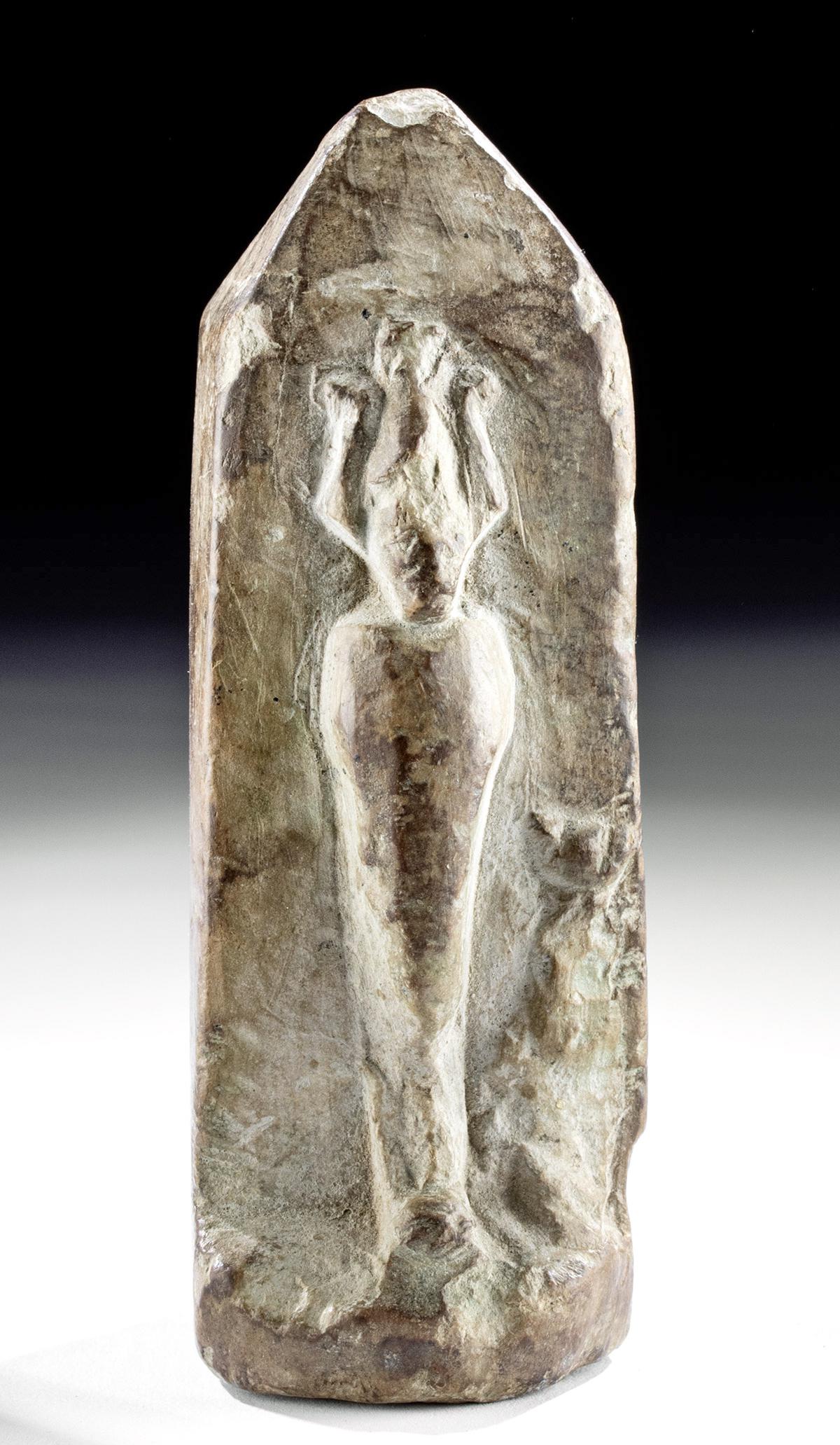 Egyptian Ptolemaic Stone Sarcophagus w/ Osiris: Egypt, Ptolemaic period, ca. 332 to 30 BCE. A hand-carved stone sarcophagus of a petite form with a tapered top portion representative of an obelisk with a flat base, tall sides, and a hollow verso me