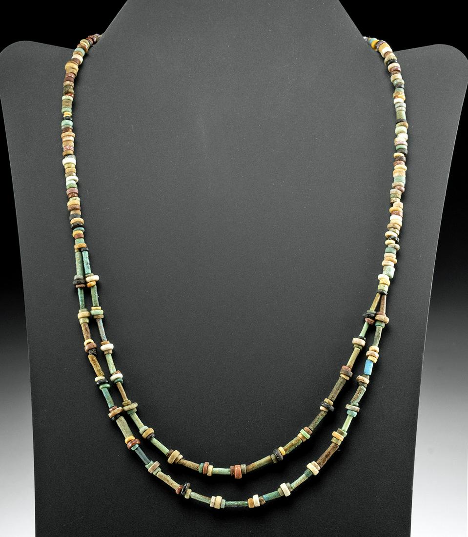 Egyptian Faience Bead Necklace: Ancient Egypt, Third Intermediate to Late Dynastic Period, 21st to 31st Dynasty, ca 1070 to 332 BCE. A stunning necklace comprised of dozens and dozens of tubular and disc-shaped faience beads of aqua